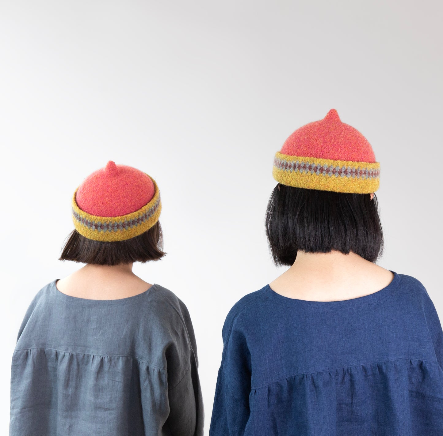Mustard yellow patterned edge and red top woollen hat
