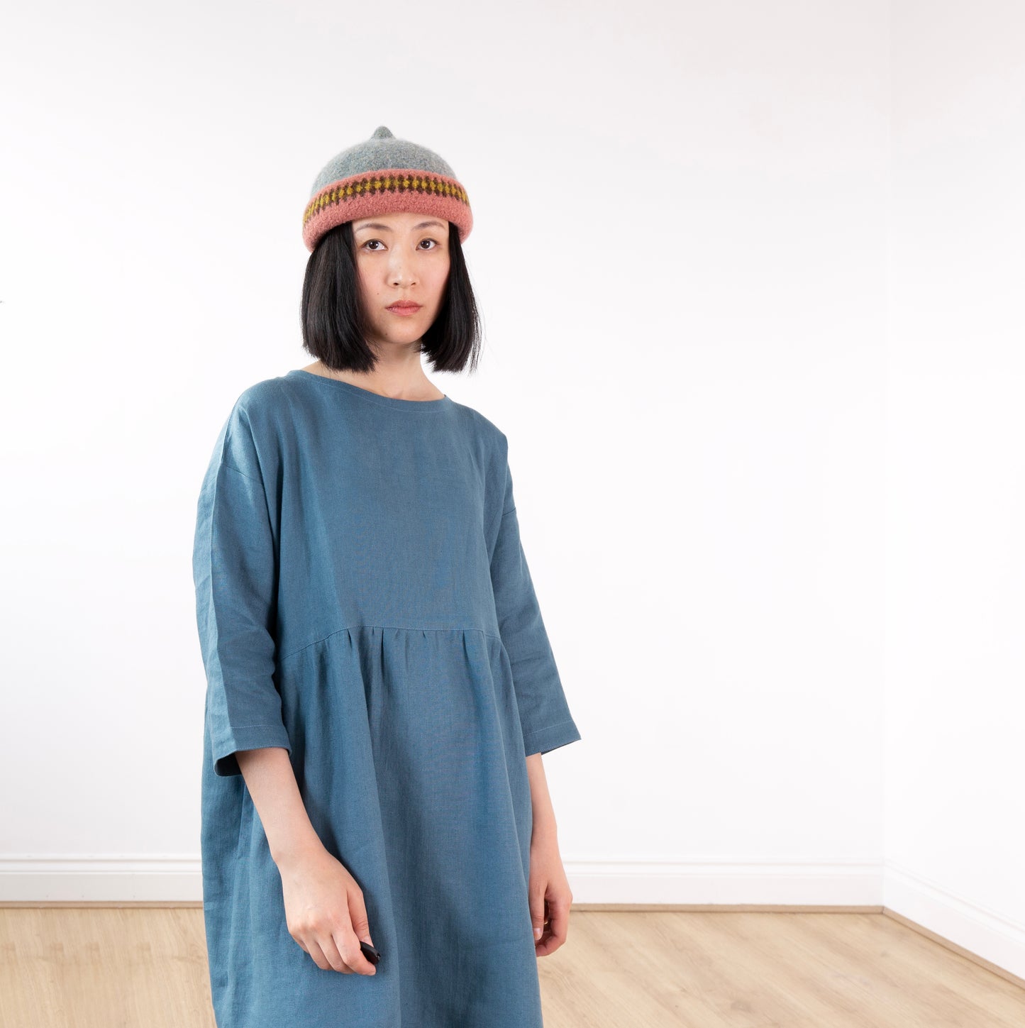 Pink patterned edge and grey top woollen hat