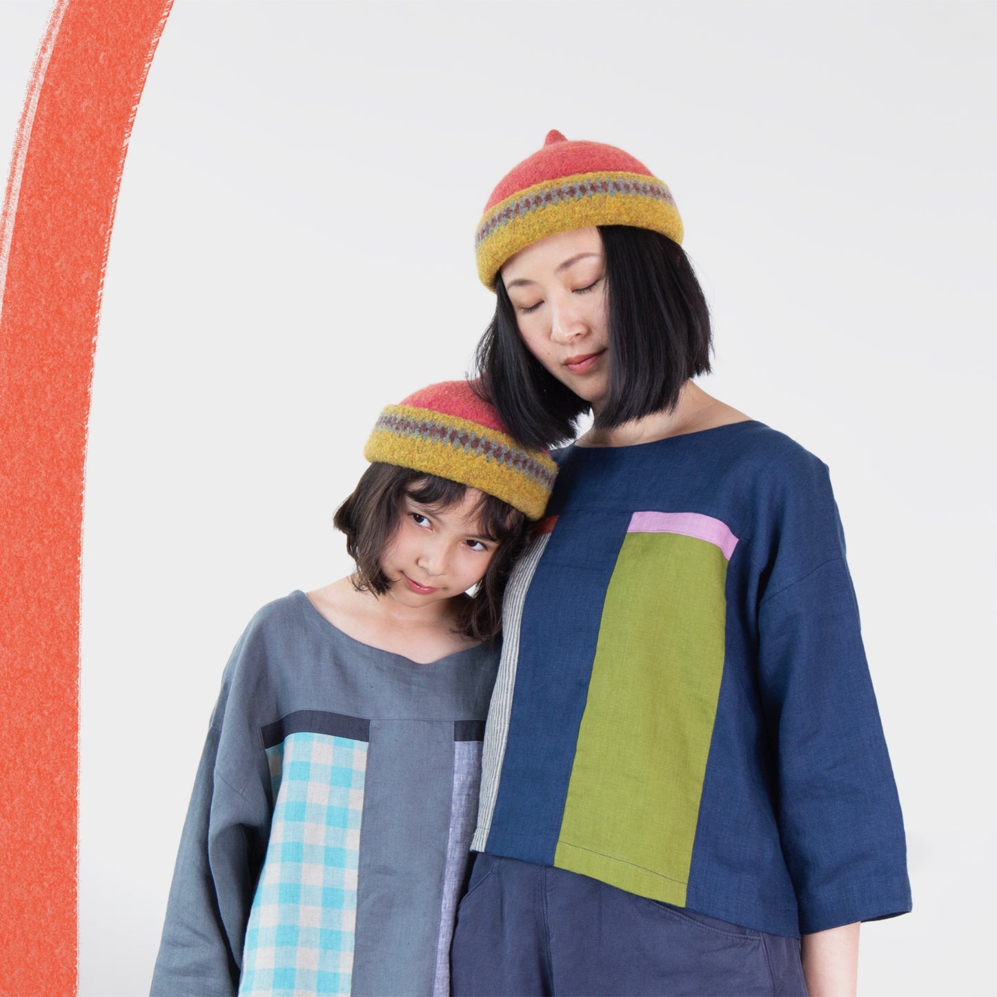 Mustard yellow patterned edge and red top woollen hat