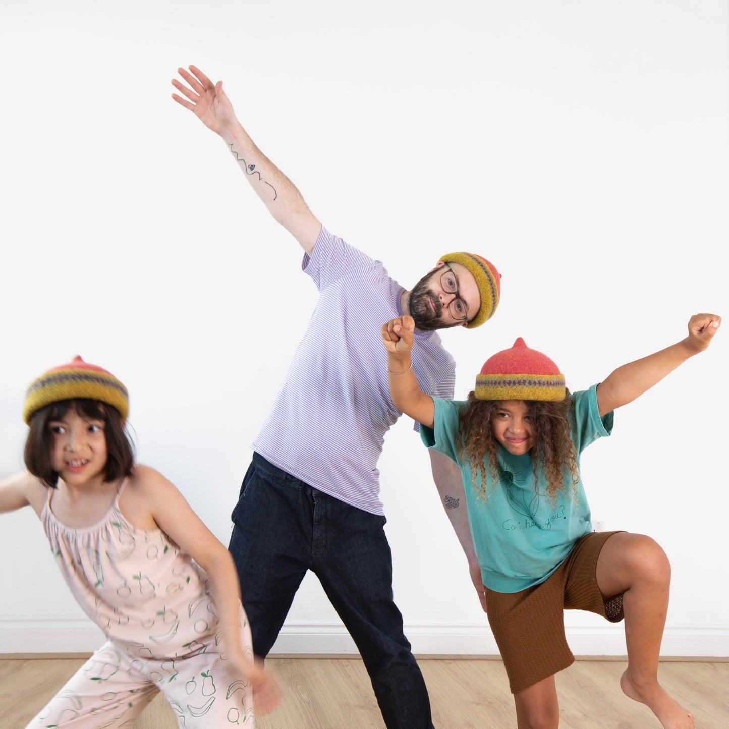 Mustard yellow patterned edge and red top woollen hat