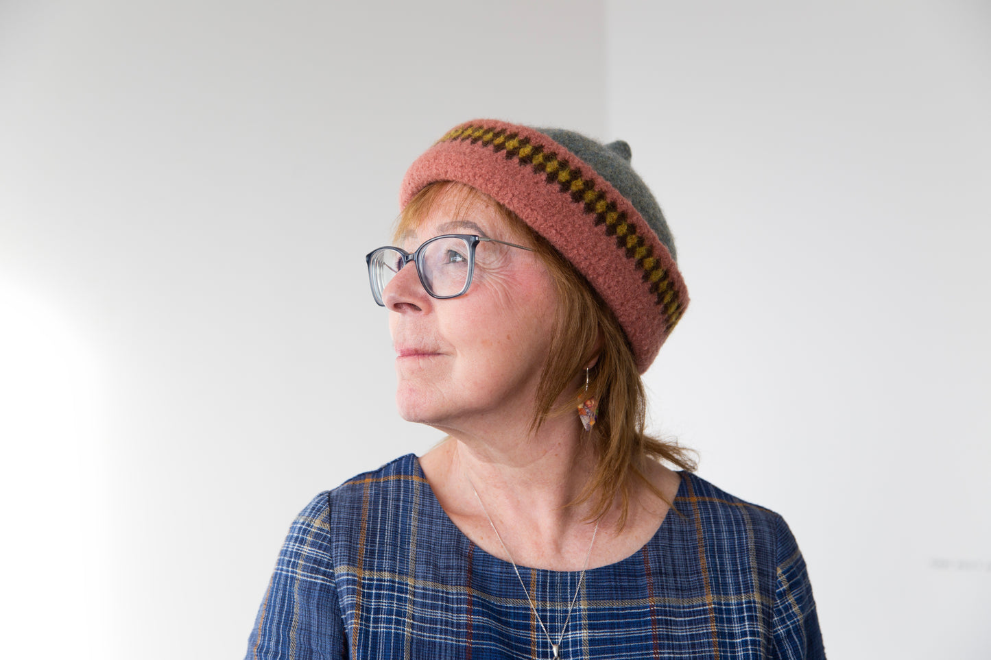 Pink patterned edge and grey top woollen hat