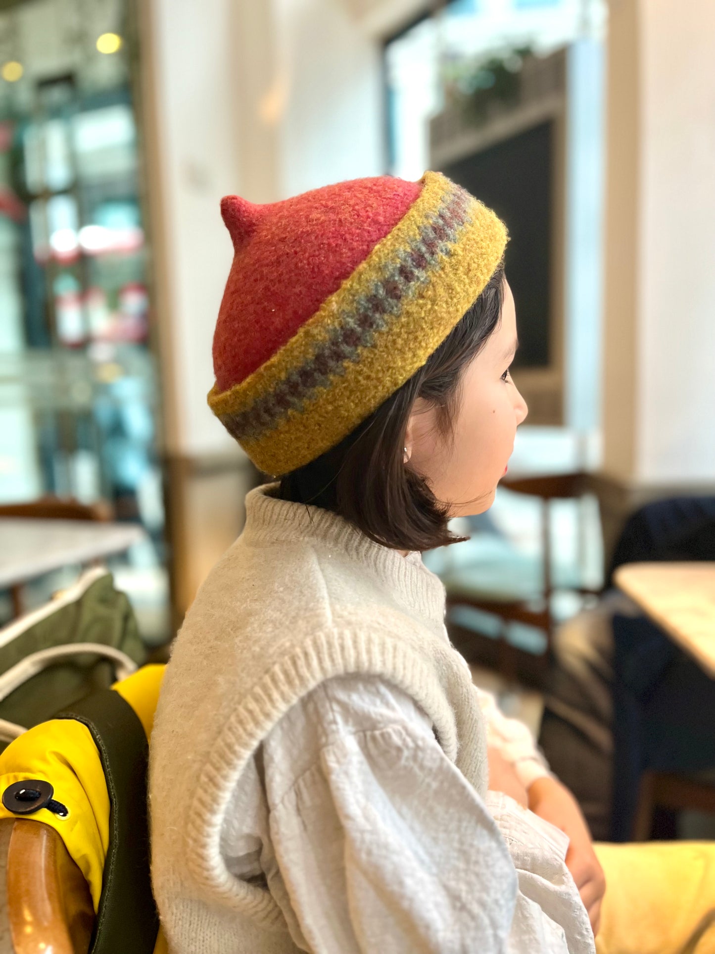 Mustard yellow patterned edge and red top woollen hat
