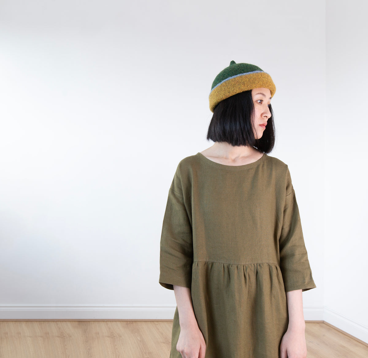 Dark mustard yellow edge and green top woollen hat