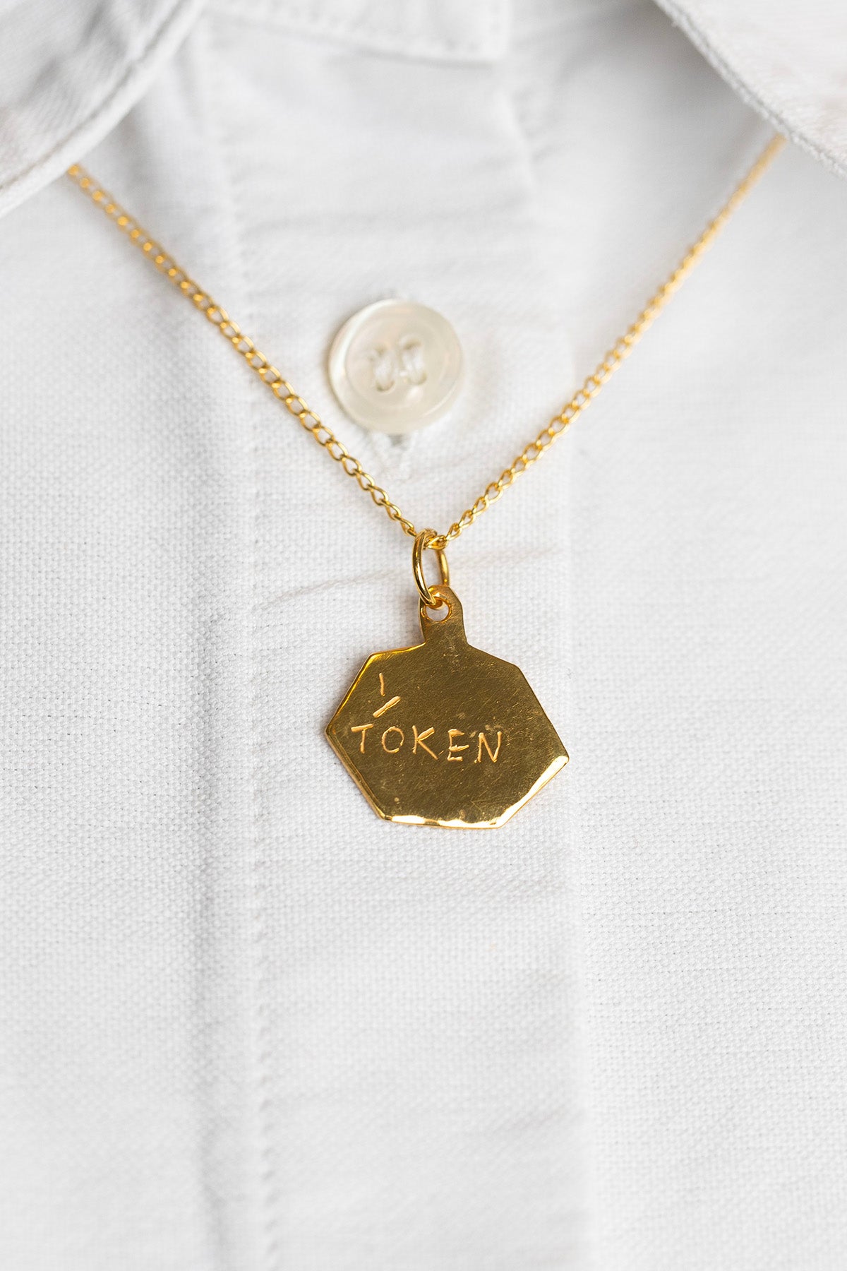 Token Pendants by Lucy Clout (gold-plated silver)