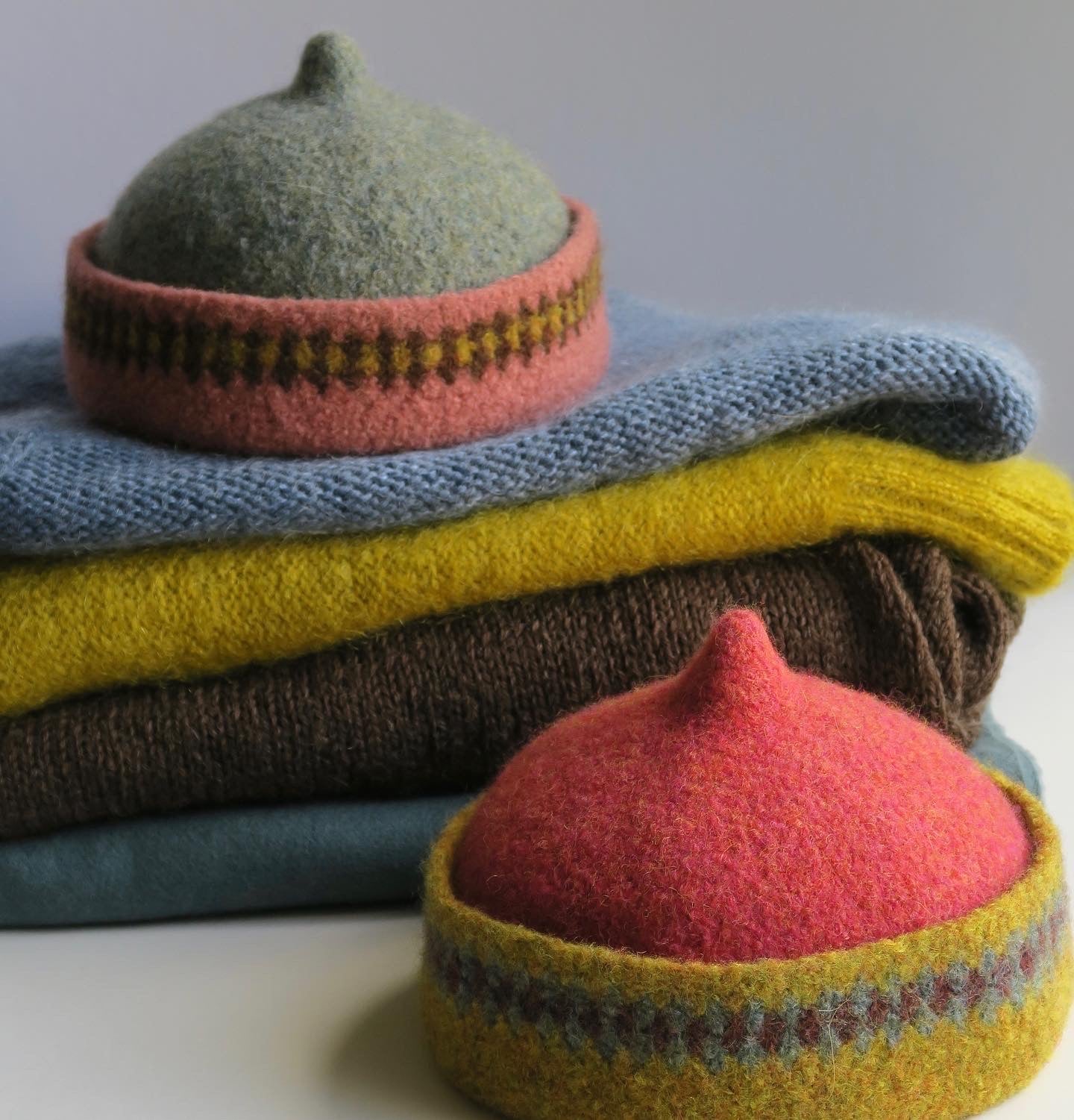 Mustard yellow patterned edge and red top woollen hat