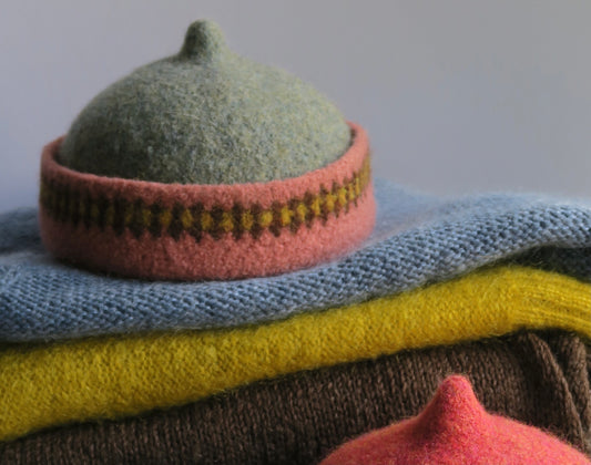 Pink patterned edge and grey top woollen hat